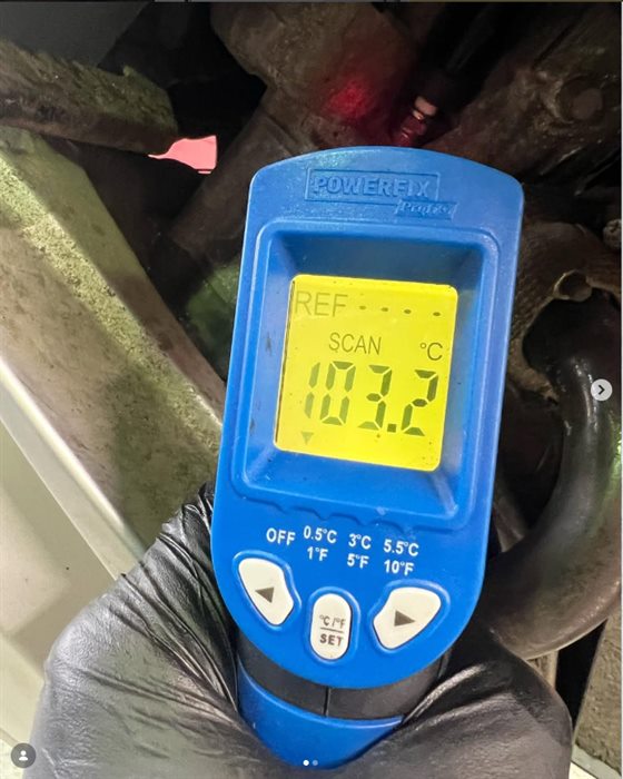 Infrared thermometer reading an engine temperature at SNS Motorcycles