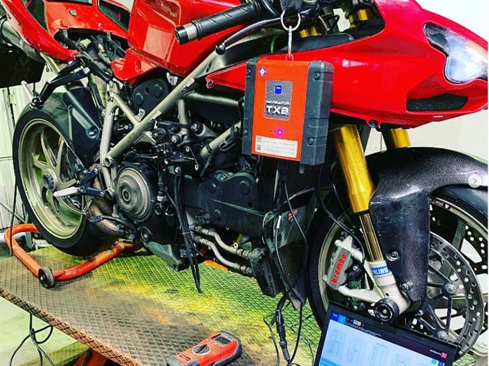 TEXA diagnostic unit and laptop connected to a Ducati at SNS Motorcycles
