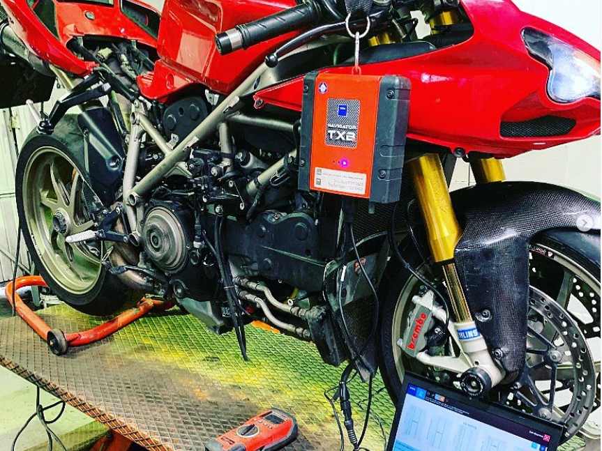 TEXA diagnostic unit and laptop connected to a Ducati at SNS Motorcycles