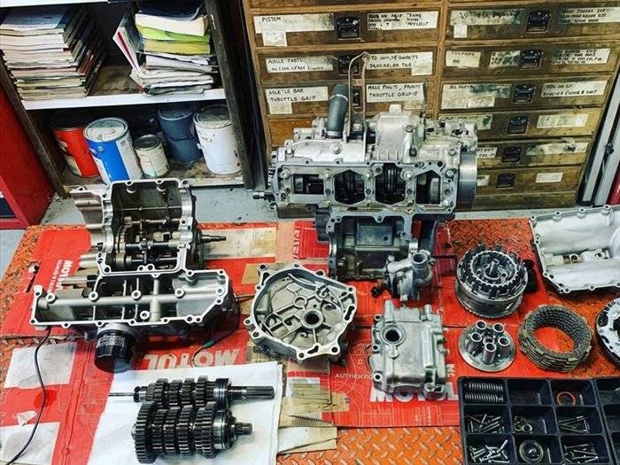 Crankcases, clutch and gearbox laid out during an engine rebuild