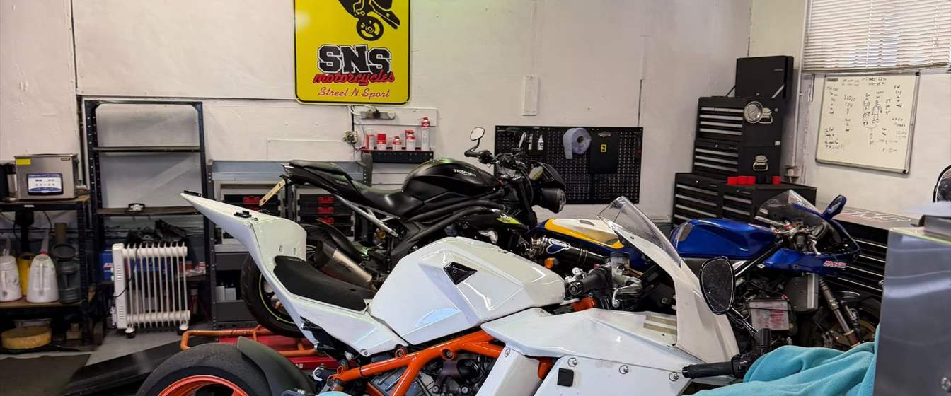 Inside the SNS Motorcycles workshop with bikes in for work
