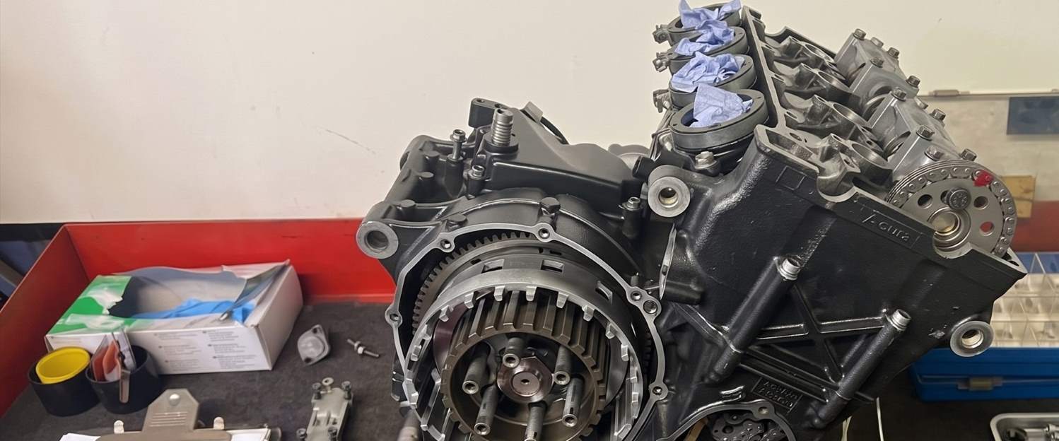 Engine on the bench part-way through a rebuild, with build notes alongside