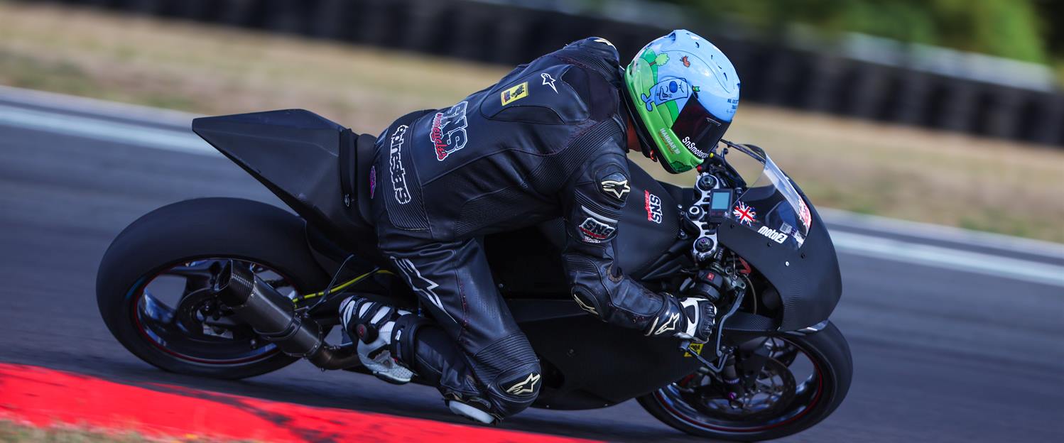 Sports bike on a circuit under hard acceleration
