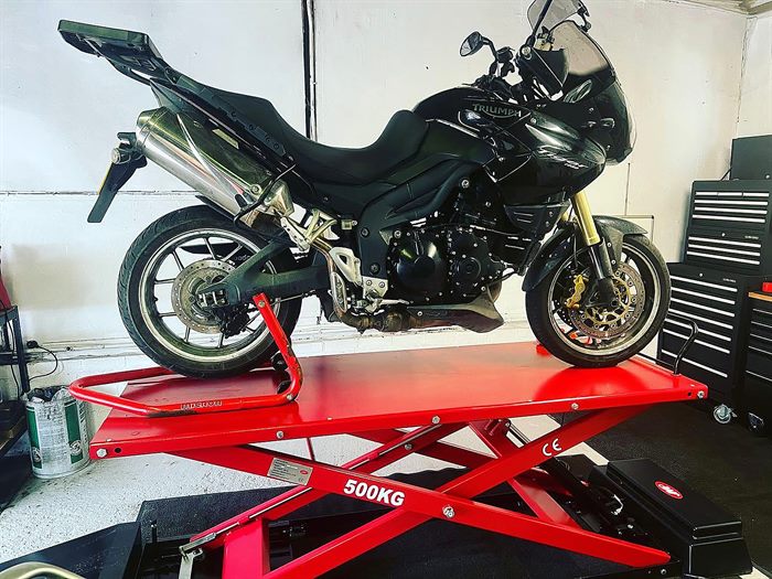 Triumph Tiger on the lift at SNS Motorcycles