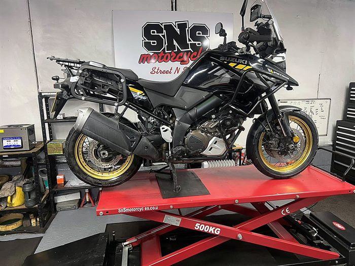 Suzuki V-Strom on the lift at SNS Motorcycles